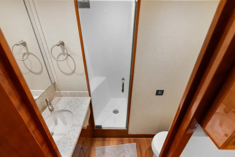Slide: The Image of Bathroom interior of 2017 Hatteras GT54 yacht with shower and sink. - 56