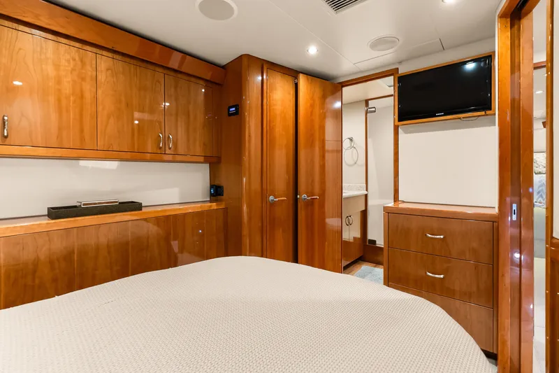 Slide: The Image of Luxurious cabin interior of 2017 Hatteras GT54 yacht with wood finishes and modern amenities. - 54