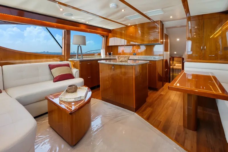 Slide: The Image of Luxurious interior of 2017 Hatteras GT54 yacht with elegant wood finishes and modern furnishings. - 39