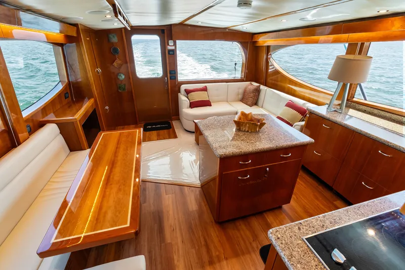 Slide: The Image of Luxurious interior of 2017 Hatteras GT54 yacht with elegant wood finishes and ocean view. - 48