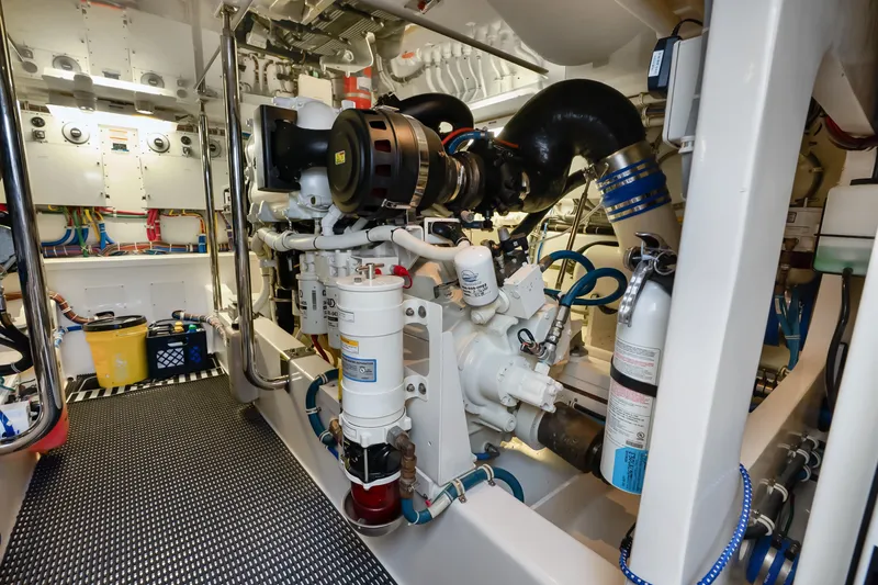 Slide: The Image of Engine room of 2017 Hatteras GT54 yacht, showcasing machinery and equipment. - 79