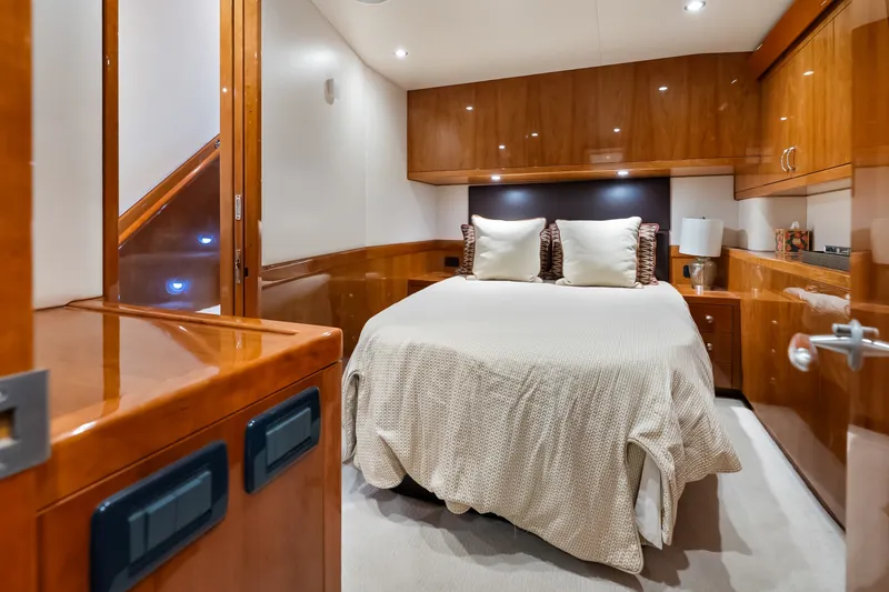 Slide: The Image of Luxurious cabin interior of 2017 Hatteras GT54 yacht with elegant wood finishes. - 55