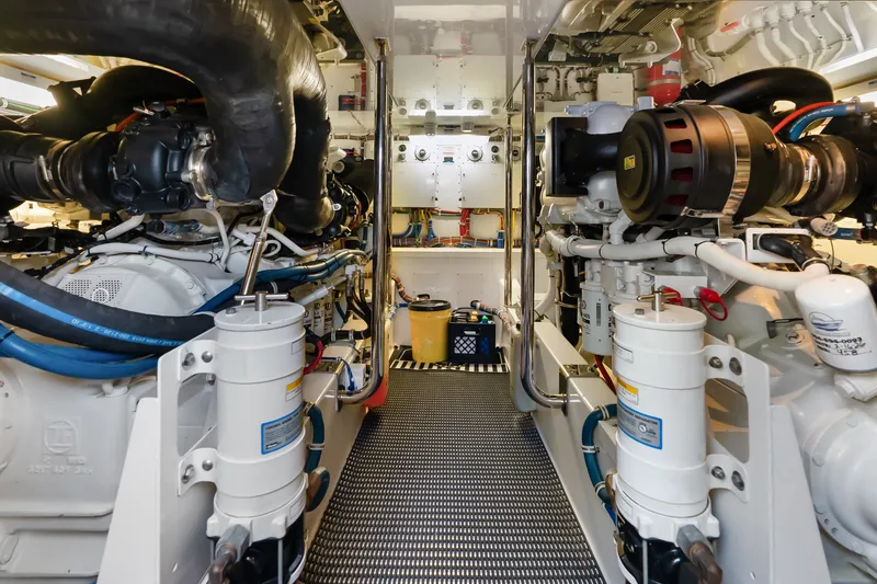 Slide: The Image of Engine room of 2017 Hatteras GT54 yacht, showcasing advanced machinery and equipment. - 78