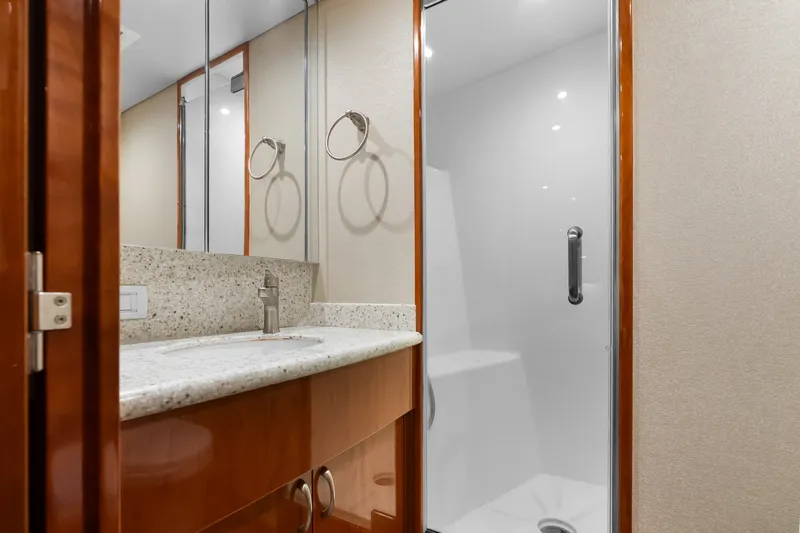 Slide: The Image of Luxurious bathroom interior of 2017 Hatteras GT54 yacht with modern fixtures and shower. - 57