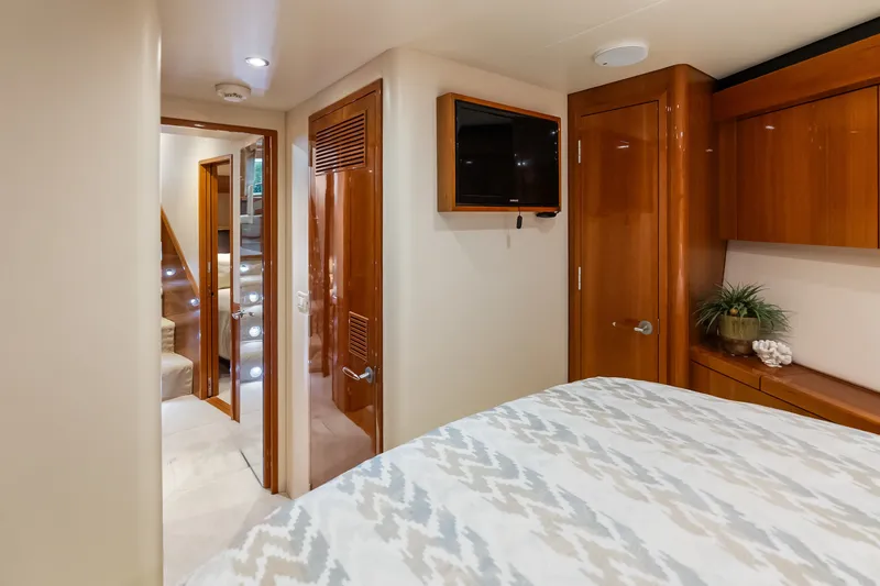 Slide: The Image of Luxurious interior of 2017 Hatteras GT54 yacht with wood finishes and modern amenities. - 69