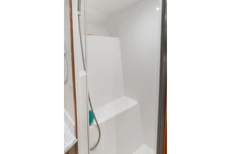 Slide: The Image of Shower area inside 2017 Hatteras GT54 yacht, featuring sleek design and modern fixtures. - 58