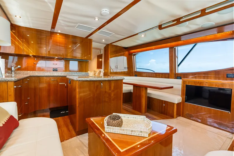 Slide: The Image of Luxurious 2017 Hatteras GT54 yacht interior with elegant wood finishes and modern amenities. - 42