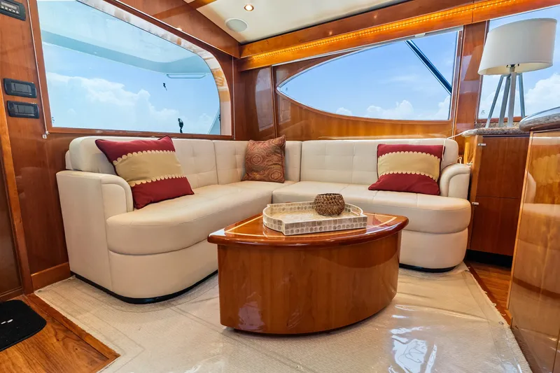 Slide: The Image of Luxurious interior of 2017 Hatteras GT54 yacht with plush seating and elegant decor. - 41