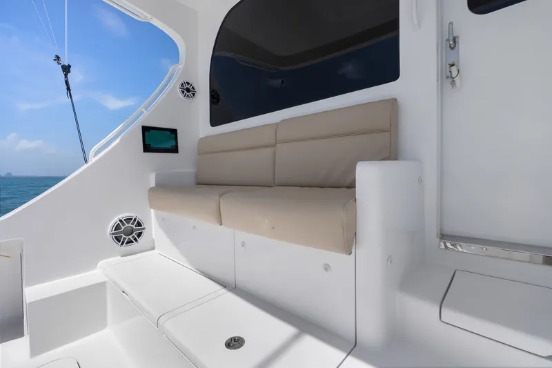 Slide: The Image of 2017 Hatteras GT54 yacht interior with beige seating and ocean view. - 37