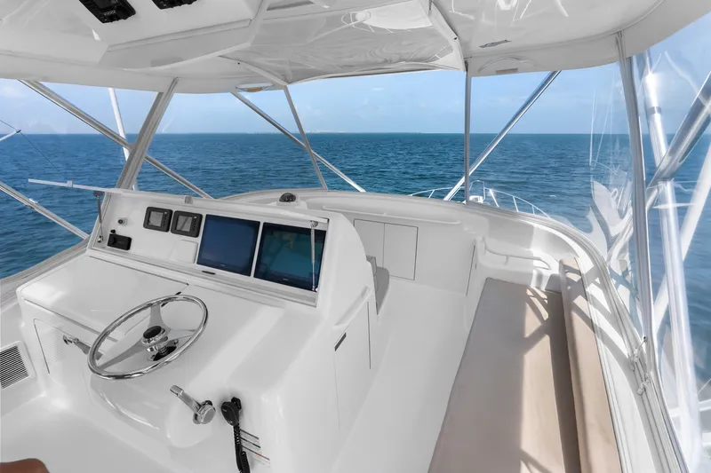 Slide: The Image of Helm of 2017 Hatteras GT54 yacht with ocean view and navigation equipment. - 26