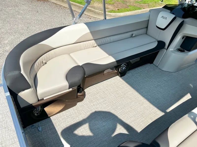 Slide: The Image of The image shows an elegant seating area on a boat with gray and black upholstery. - 9