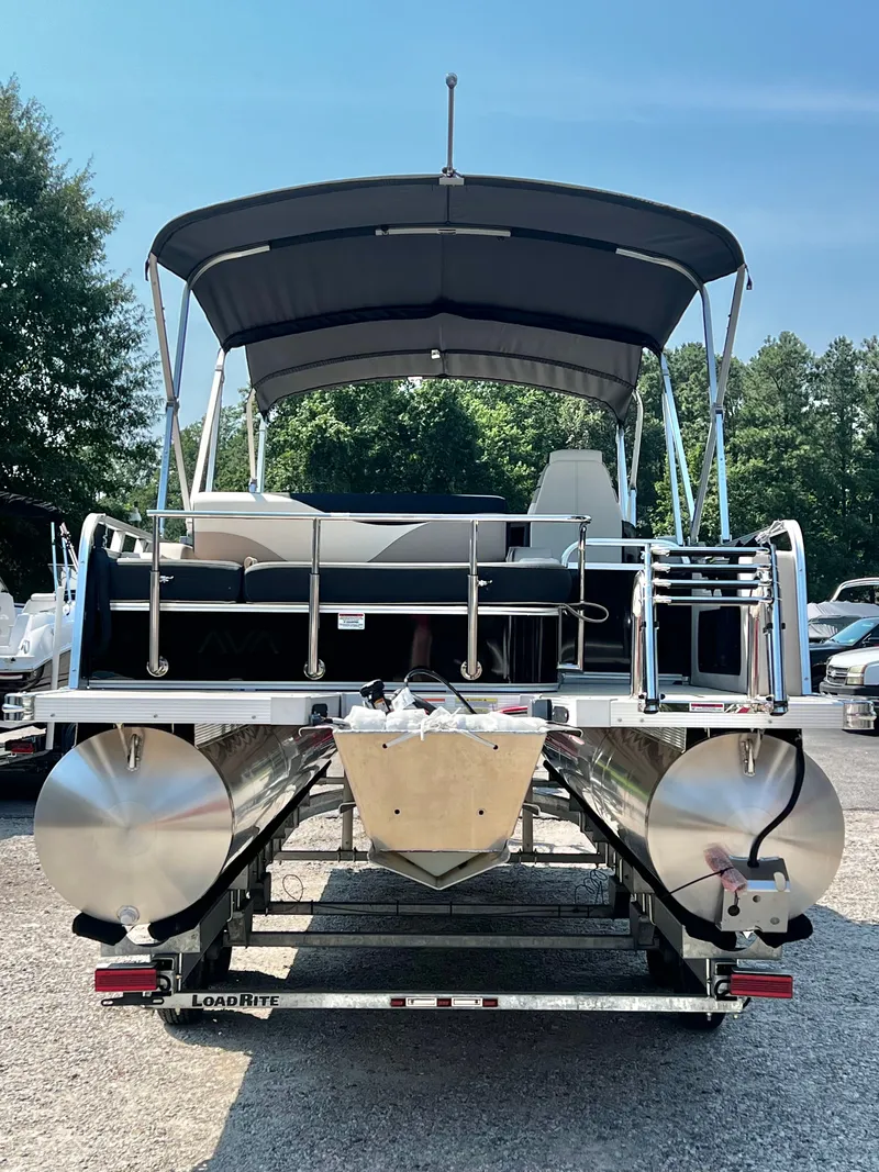 Slide: The Image of An Avalon LSZ 25' Entertainer pontoon boat from 2027 sits on a trailer, ready for adventure. - 4