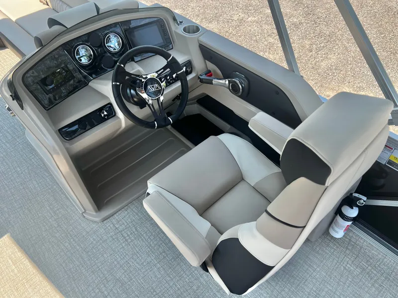 Slide: The Image of The image shows the helm of a 2027 Avalon LSZ 25' Entertainer with a sleek steering wheel and comfortable seat. - 22