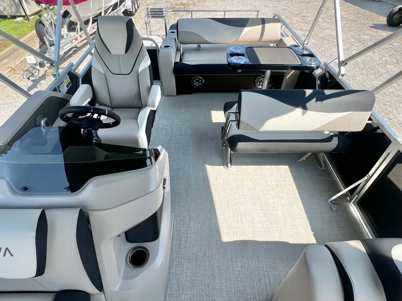 Slide: The Image of The image shows the interior of a 2027 Avalon LSZ 25' Entertainer boat with sleek seating and a table. - 11