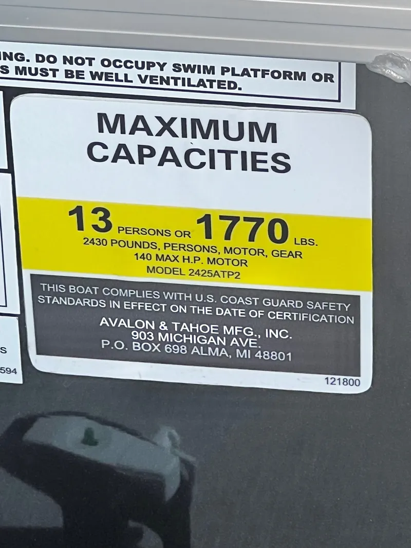 Slide: The Image of Capacity sign: 13 persons or 1770 pounds. Manufacturer details below. - 28