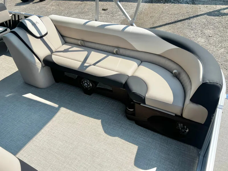 Slide: The Image of Elegant seating on an Avalon LSZ 25' Entertainer pontoon boat, featuring beige and black upholstery. - 10