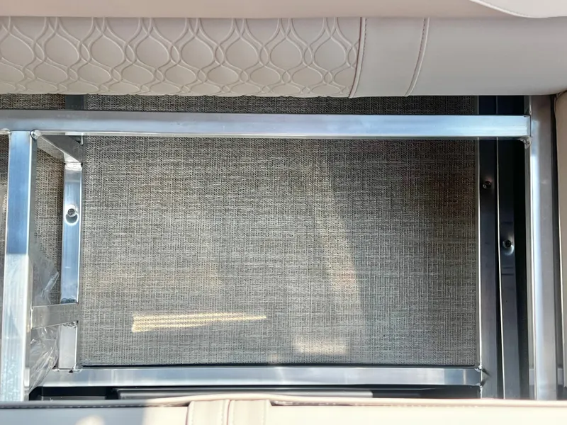 Slide: The Image of Close-up of a cushioned seat with a metal frame and textured fabric. - 29