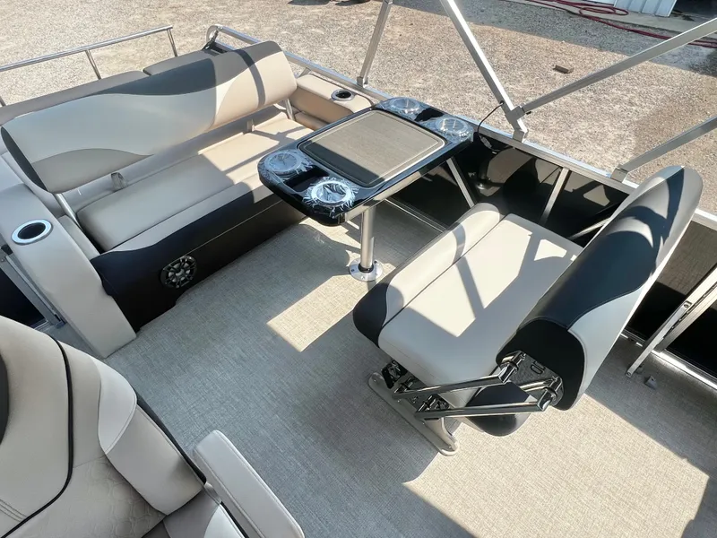Slide: The Image of The image shows the interior of an Avalon LSZ 25' Entertainer with sleek seating and a table. - 14