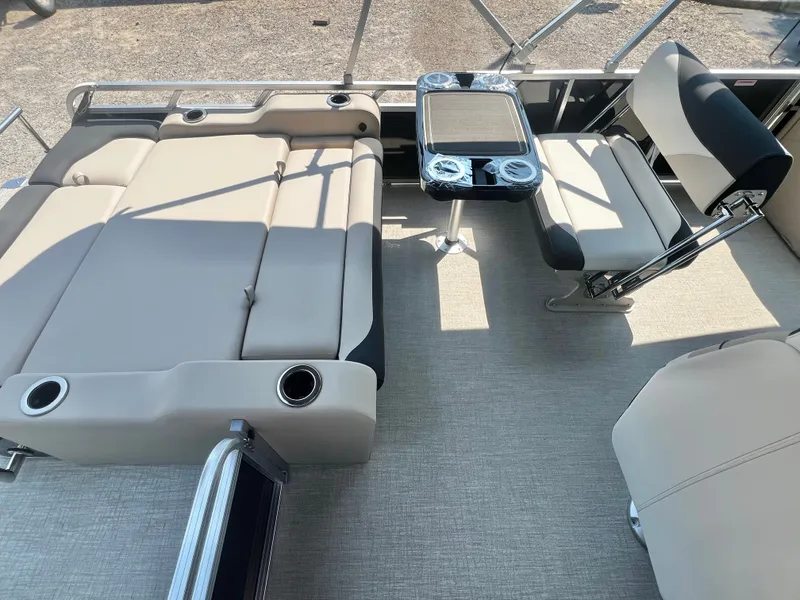 Slide: The Image of The image shows the interior of an Avalon LSZ 25' Entertainer with beige upholstery and a table. - 20