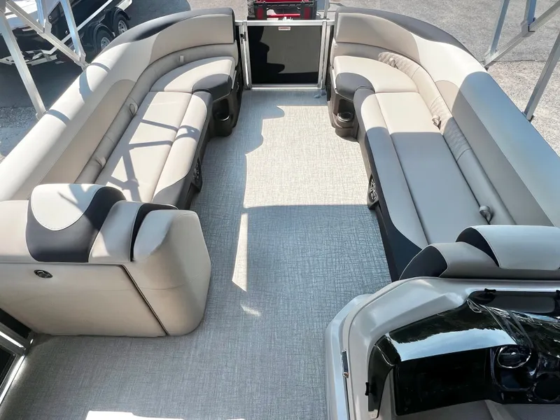 Slide: The Image of The image shows the spacious deck of an Avalon LSZ 25' Entertainer with comfortable seating. - 24