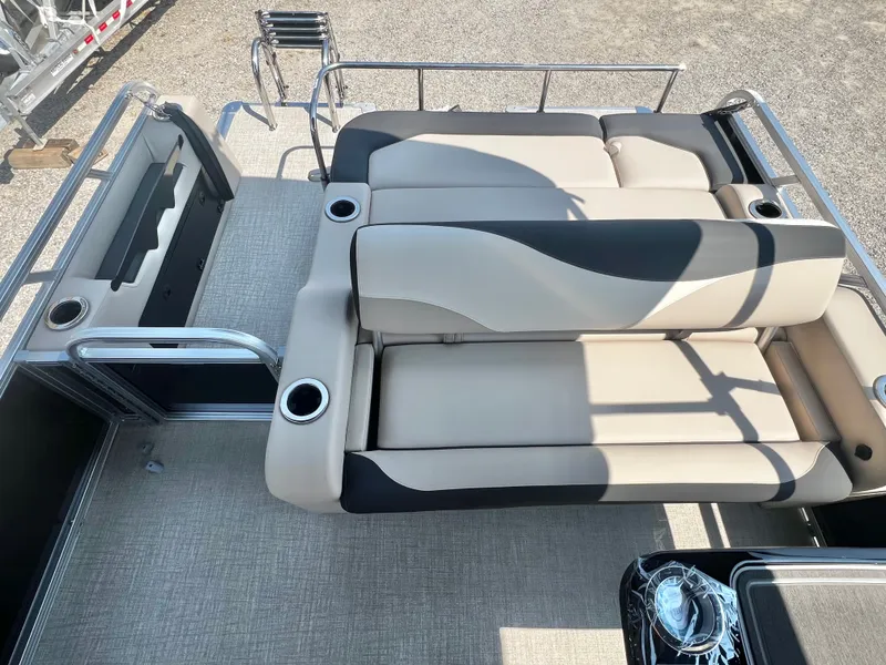 Slide: The Image of The image shows the deck of a 2027 Avalon LSZ 25' Entertainer with beige and black upholstery. - 15