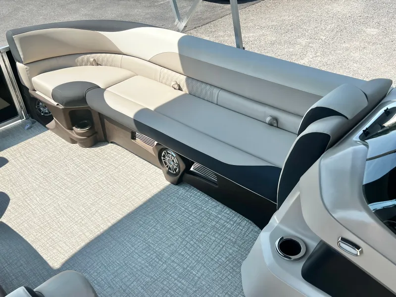 Slide: The Image of The image shows a luxurious seating area on a boat with beige and black upholstery. - 27