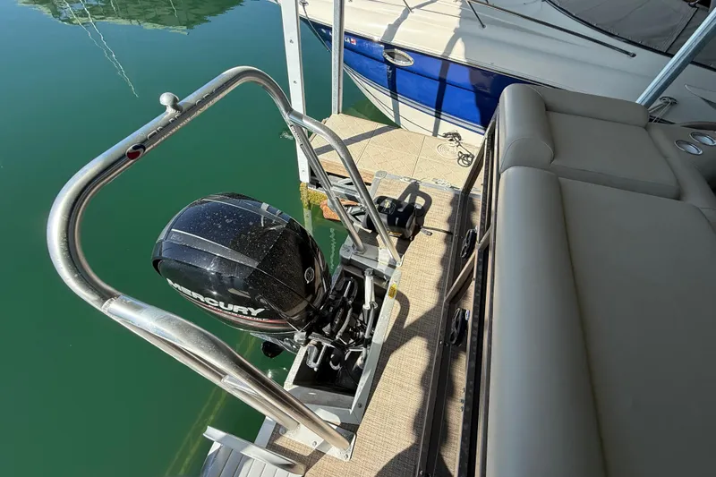 Slide: The Image of 2017 Bentley Pontoons 223 Cruise with Mercury outboard motor, docked on calm water. - 16