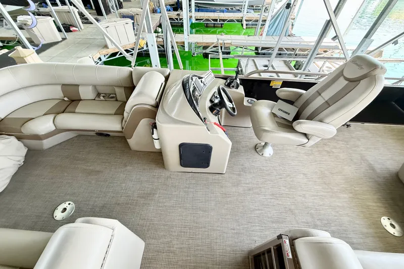 Slide: The Image of 2017 Bentley Pontoons 223 Elite Cruise interior with plush seating and modern helm. - 20