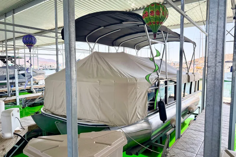 Slide: The Image of 2017 Bentley Pontoons 223 Elite Cruise covered at marina dock with decorative balloons. - 15