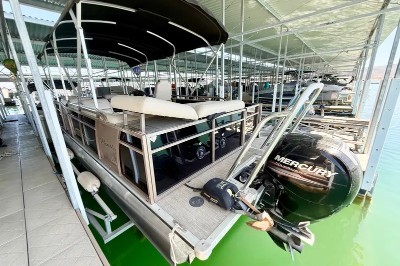 Slide: The Image of 2017 Bentley Pontoons 223 Elite Cruise docked with Mercury outboard engine. - 17