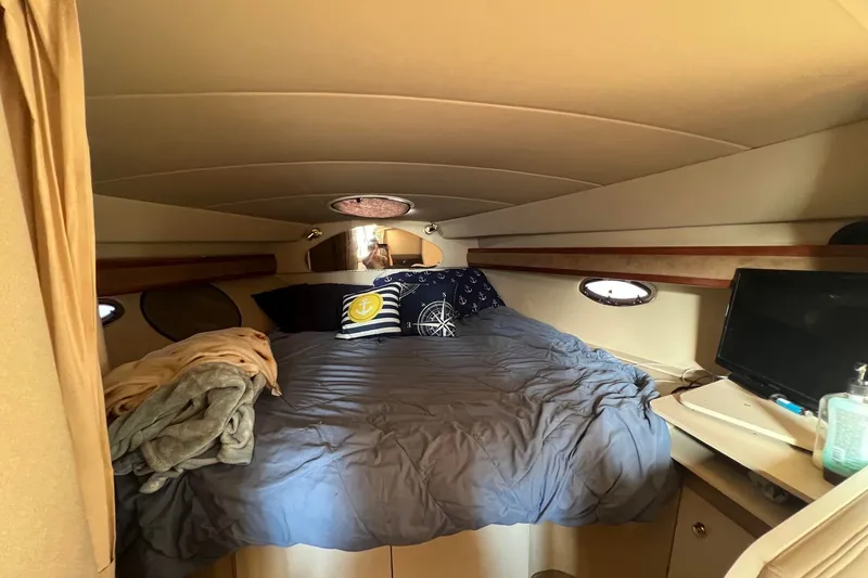 Slide: The Image of Cozy cabin interior of 2003 Cruisers Yachts 3372 Express with bed and nautical decor. - 39