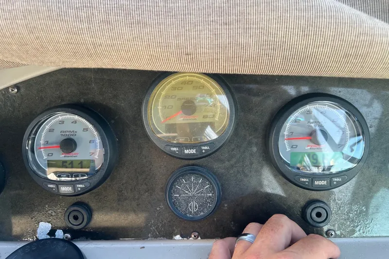 Slide: The Image of Dashboard of a 2003 Cruisers Yachts 3372 Express with gauges and controls. - 17