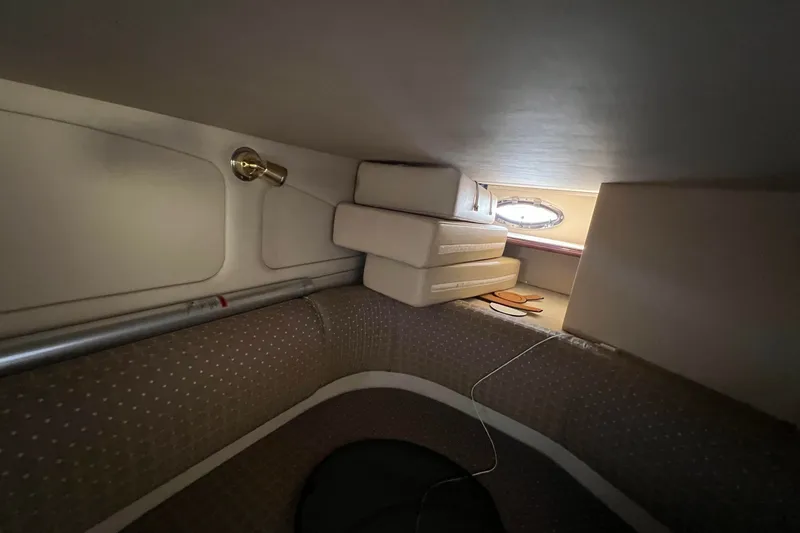 Slide: The Image of Interior cabin of 2003 Cruisers Yachts 3372 Express with cushions and porthole. - 42