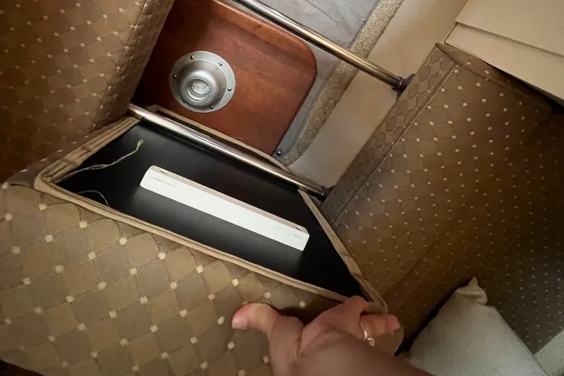 Slide: The Image of Interior view of 2003 Cruisers Yachts 3372 Express, showcasing seating and storage. - 41