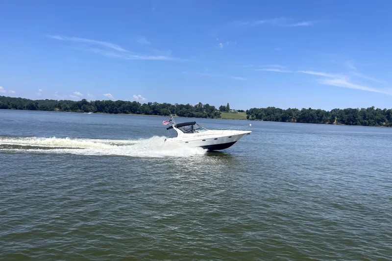 Slide: The Image of 2003 Cruisers Yachts 3372 Express cruising on a sunny lake. - 26