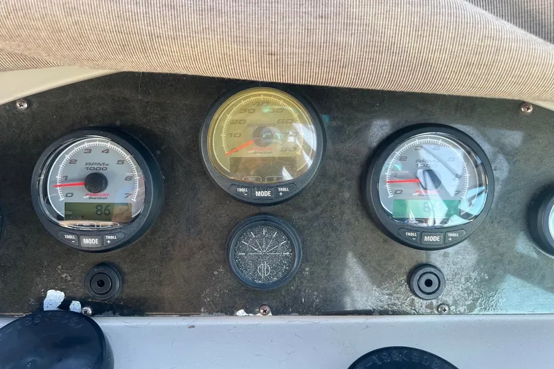 Slide: The Image of Dashboard of a 2003 Cruisers Yachts 3372 Express with Mercury SmartCraft gauges. - 18