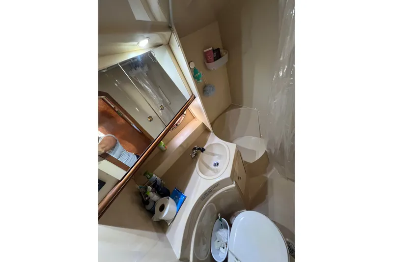 Slide: The Image of Bathroom interior of 2003 Cruisers Yachts 3372 Express, featuring sink and shower. - 36