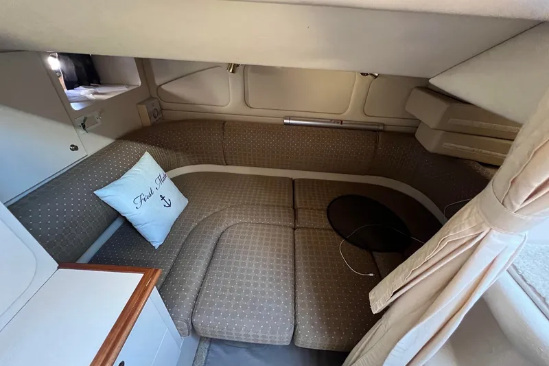 Slide: The Image of Interior of 2003 Cruisers Yachts 3372 Express, featuring cozy seating and nautical decor. - 43