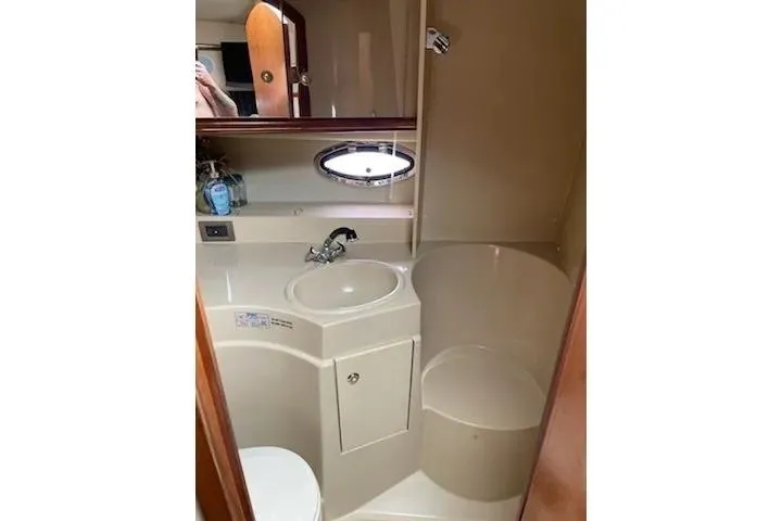 Slide: The Image of Bathroom interior of 2003 Cruisers Yachts 3372 Express with sink and shower. - 23