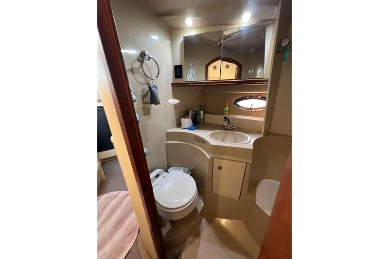Slide: The Image of Bathroom interior of 2003 Cruisers Yachts 3372 Express with sink and toilet. - 34