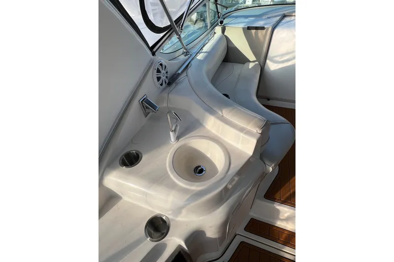 Slide: The Image of 2003 Cruisers Yachts 3372 Express interior with sink and seating area. - 50