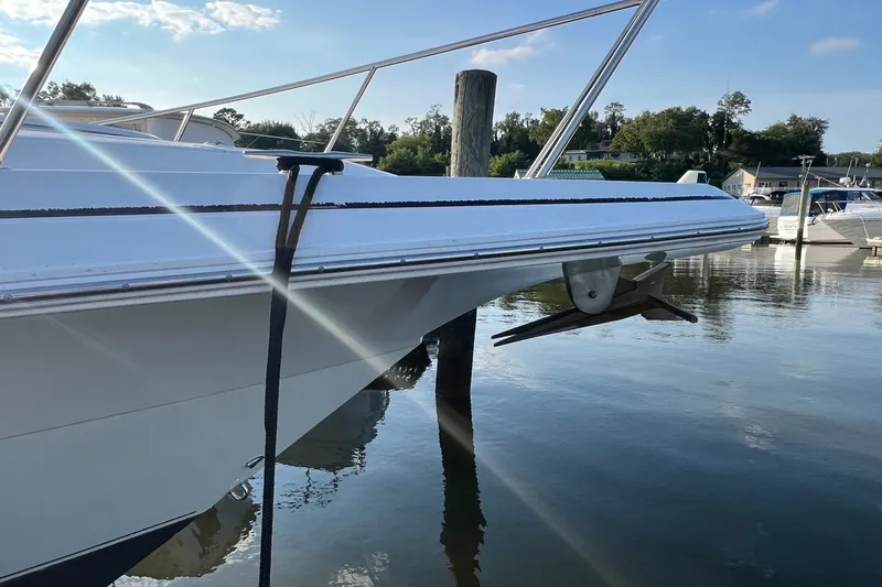 Slide: The Image of 2003 Cruisers Yachts 3372 Express docked at marina, side view. - 13