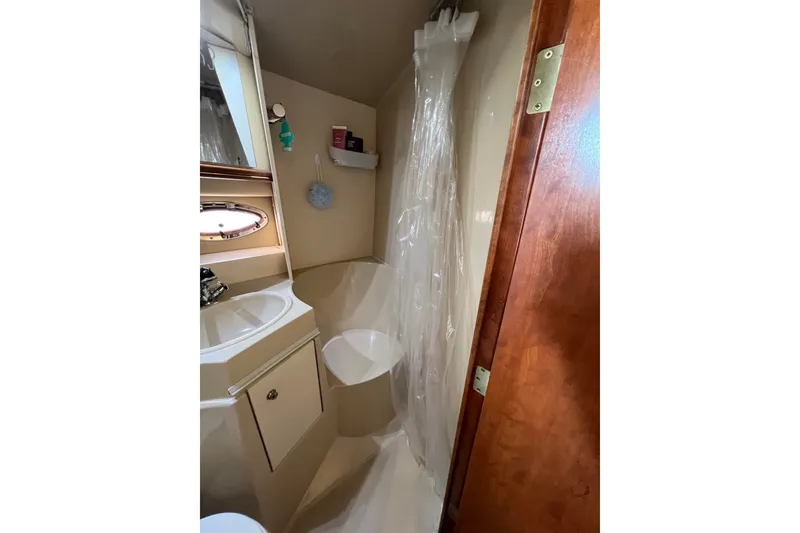 Slide: The Image of Bathroom interior of 2003 Cruisers Yachts 3372 Express with shower and sink. - 35