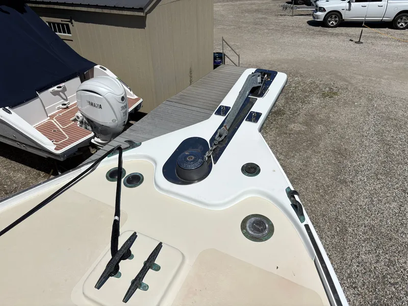 Slide: The Image of Bow of a boat with anchor windlass and rope, in a dry dock next to another boat. - 24
