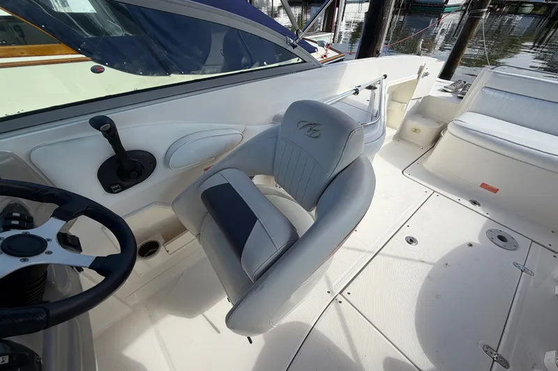 Slide: The Image of 2006 Monterey 248LS Montura Bowrider interior with steering wheel and seating. - 22