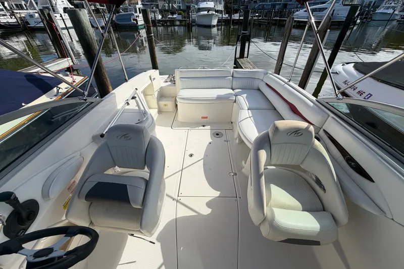 Slide: The Image of 2006 Monterey 248LS Montura Bowrider interior with seating, docked at marina. - 27