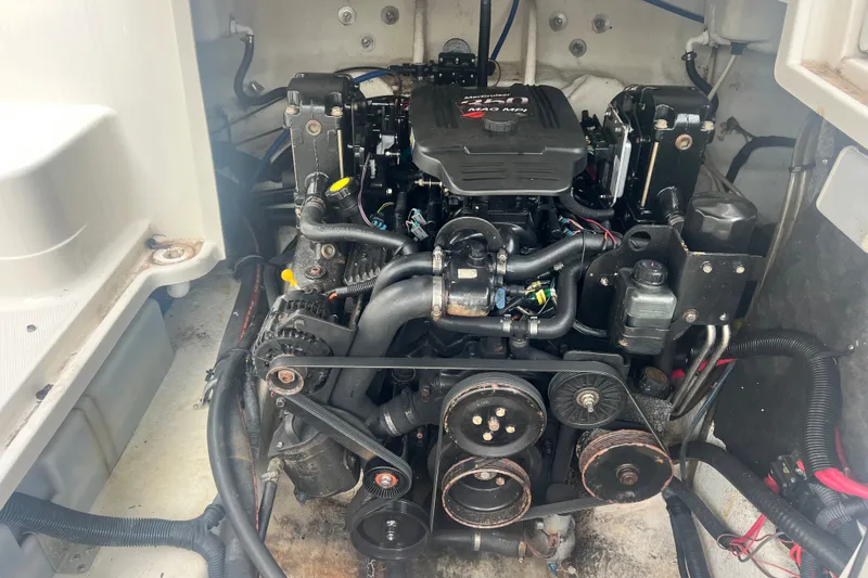 Slide: The Image of Engine compartment of a 2006 Monterey 248LS Montura Bowrider boat. - 11