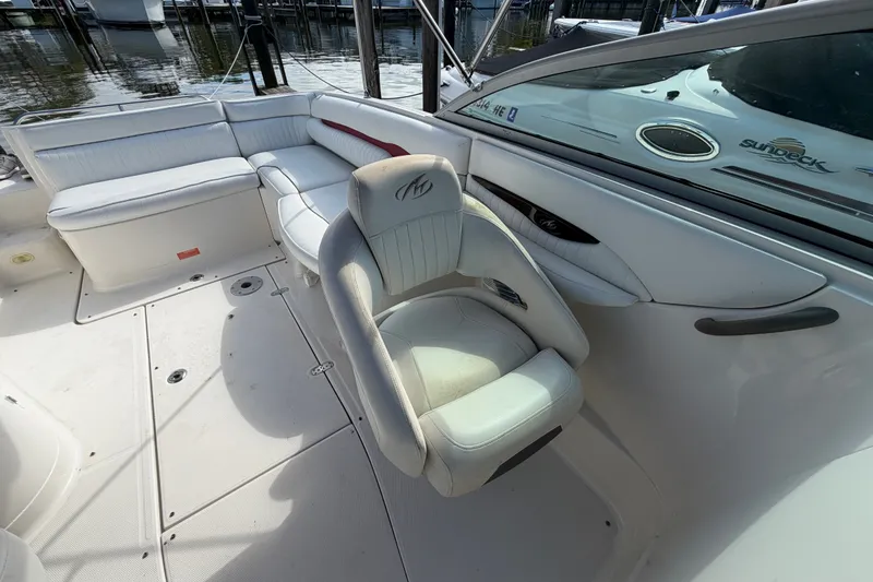 Slide: The Image of 2006 Monterey 248LS Montura Bowrider interior with white seating and sleek design. - 21