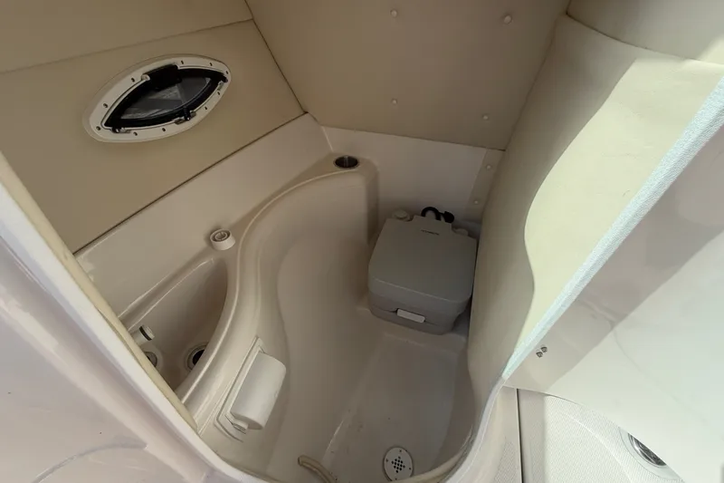 Slide: The Image of Interior of 2006 Monterey 248LS Montura Bowrider boat with compact marine toilet. - 24
