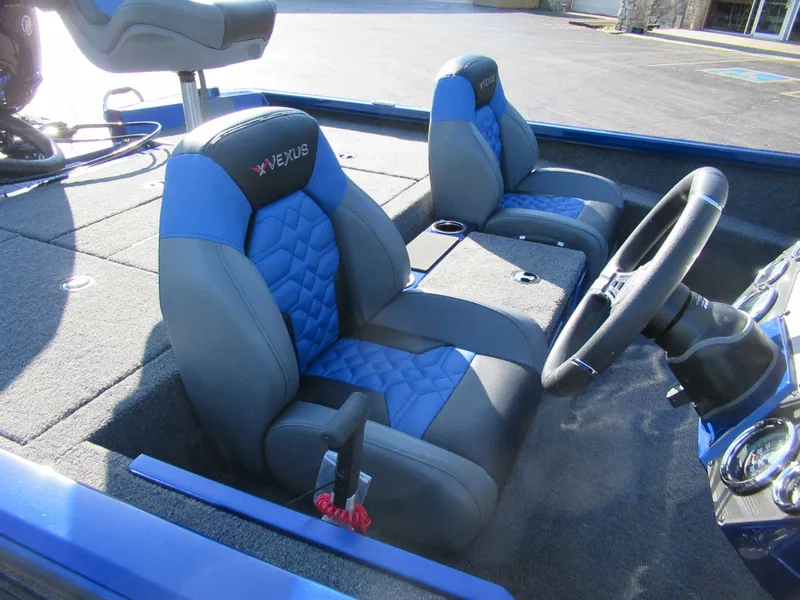 Slide: The Image of Interior of a 2027 Vexus AVX 1980 with blue and gray seating. - 9